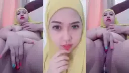 Mature Beauty In Yellow Veil Pleasuring Herself